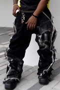 De Vinci Noir Renegade baggy jeans with a relaxed fit and dark wash, showcasing front pockets and distressed details.
