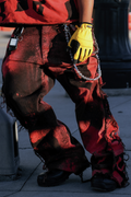 De Vinci Scarlet Ash wide-leg flared jeans with high waist and distressed details, shown on a model.